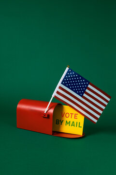 US flag and vote by mail letter in a red mailbox
