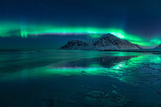 Northern Lights over Mountain and Beach