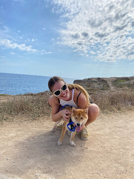 Portrait of a woman and her shiba inu dog