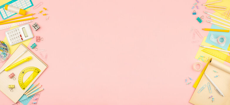 stationery items for girls or women on light pink background. Back to school. Female Student's, pupil's or engineer's supplies. Office objects on pastel pink background. Calculator, pen, pencil etc.