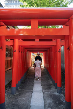 Asian mother and daughter praying in Japanese temple