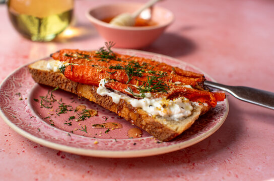 Toasted sourdough bread with roasted carrots and feta