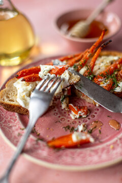 A forkful of roast carrots, toast and whipped feta
