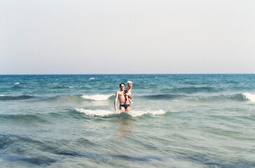 Father and son playing at beach