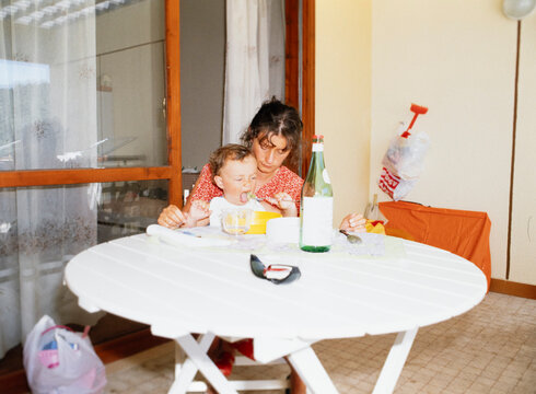 Mother and son eating together
