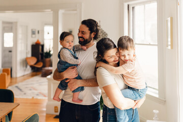 portrait of smiling and happy  family in dining room . 