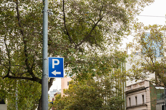 Blue parking sign hanging from a lamppost  in Melbourne Australia