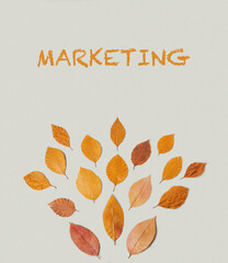 A leafy tree made of leaves with the word marketing written in orange
