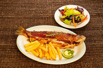 Baked trout with fries - Rainbow trout from Tota Boyaca lake. Colombian gastronomy