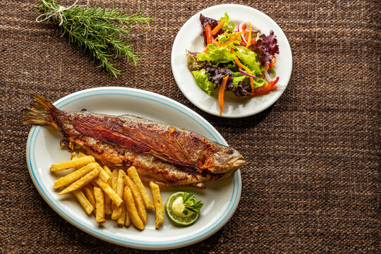 Rainbow trout from Tota Boyaca lake - Baked trout with fries. Colombian gastronomy