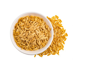 Raw Italian risoni pasta made from wheat - Raw orzo pasta in the bowl