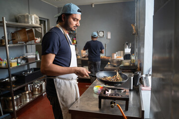 People Working At Indian Restaurant Kitchen