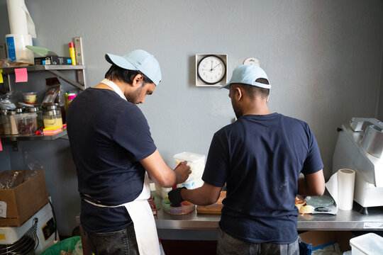 People Cooking Food At Indian Restaurant