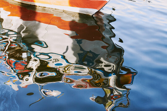 Serene Water Reflections of a Docked Boat