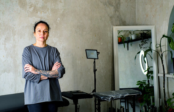 Female portrait of the owner of a tattoo parlor