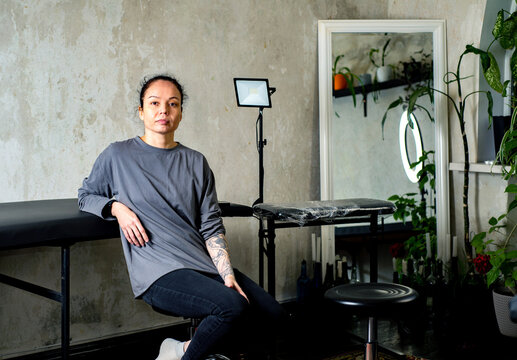 Female portrait of the owner of a tattoo parlor