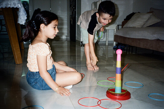 Analog Film Photo With Direct Flash Children Playing In Ring Toss Game