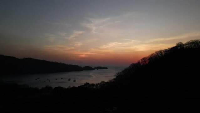 Sunset El Jobo Bay, Costa Rica over the waters and trees