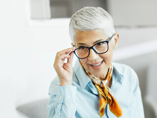 business businesswoman senior elderly office meeting woman portrait corporate manager smiling talking conversation happiness mature glasses communication discussion executive