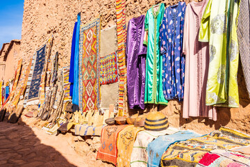 Traditional Moroccan souvenirs for sale in narrow street of Ksar Ait Ben Haddou, old Berber ancient...