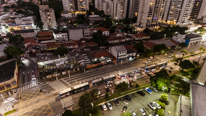 view from above of vehicle traffic and the bus lane of an avenue in the south zone of the city of Sao Paulo in the late afternoon
