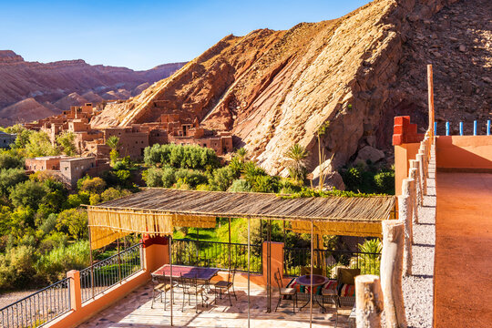 View of green oasis with palm trees and river in Dades valley from restaurant terrace near Anmiter town in Atlas Mountains, Morocco, North Africa