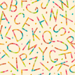 A lively and colorful array of jumbled letters forms an abstract pattern, creating a whimsical and vibrant design reminiscent of childhood playfulness and creative expression.