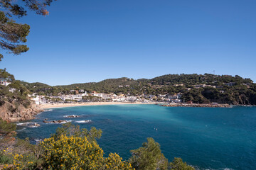 Beautiful turquoise beach in quiet Mediterranean waters in a town in Costa Brava, Catalonia