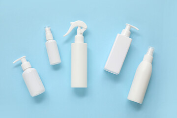 Different cosmetic products on blue  background