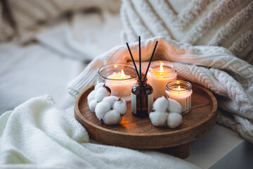 Cozy corner for home meditation, relaxation, detention. Aroma reed diffuser, aromatic burning...