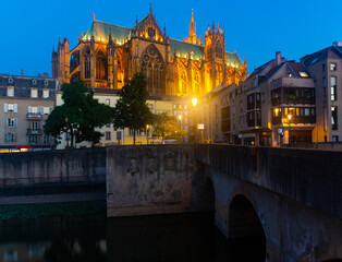 Night view of gothic cathedral of Metz illuminated by yellow light. Roman Catholic cathedral in...