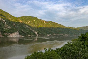 The sky is partly cloudy, and the scene is devoid of any human presence, emphasizing the tranquility and natural beauty of the area.