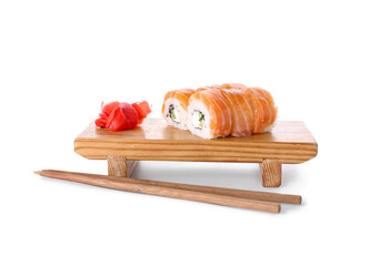 Board with tasty sushi rolls, marinated ginger and chopsticks on white background