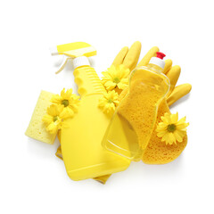 Set of cleaning supplies with spring flowers on white background