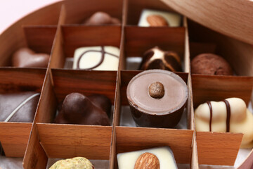Box with sweet chocolate candies, closeup