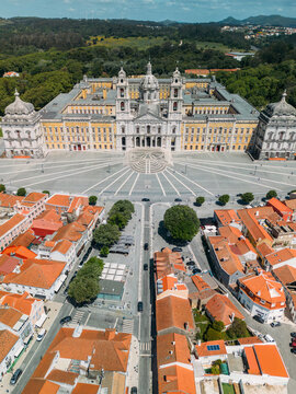 Aerial drone view of Convent of Mafra and lovely village houses, Portugal - UNESCO World Heritage Site