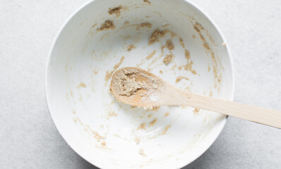 dough in a bowl that has been scraped clean, Leftover dough batter in a white mixing bowl