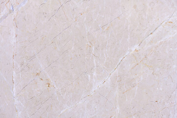 Close-up of a marble surface showing natural cracks and patterns, highlighting the texture and imperfections of the stone. Stone wall flooring ceramic tile, faience patterns, texture, background