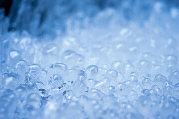 Extreme closeup of frozen ice structures from water spray 