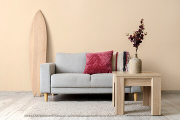 Surfboard, sofa and coffee table in living room
