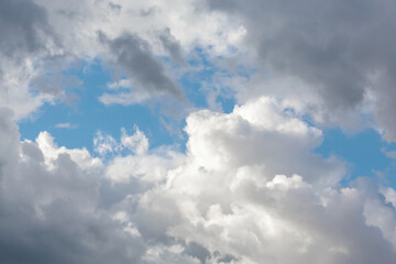 Dramatic cloudy sky with patches of blue, nature background for weather forecast, climate change concept, serene scene