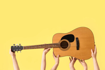 Women with guitar on yellow background