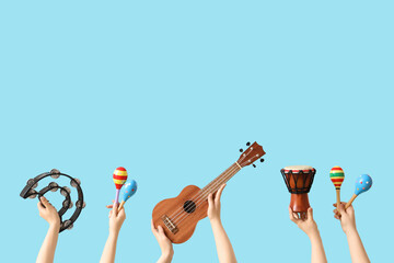 Women with different musical instruments on blue background