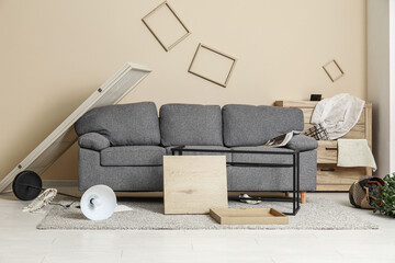 Interior of living room with sofa after earthquake