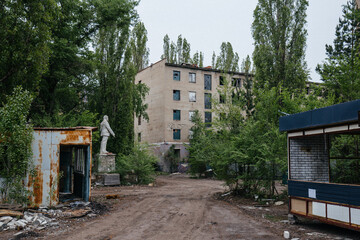 Abandoned white brick multistory houses, decaying cityscape of ghost town