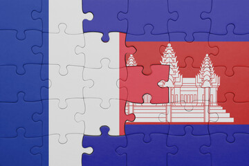 puzzle with the colourful national flag of cambodia and flag of france.