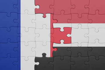 puzzle with the colourful national flag of yemen and flag of france.