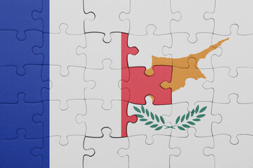 puzzle with the colourful national flag of cyprus and flag of france.