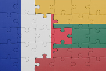 puzzle with the colourful national flag of lithuania and flag of france.