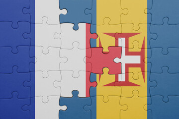 puzzle with the colourful national flag of madeira and flag of france.